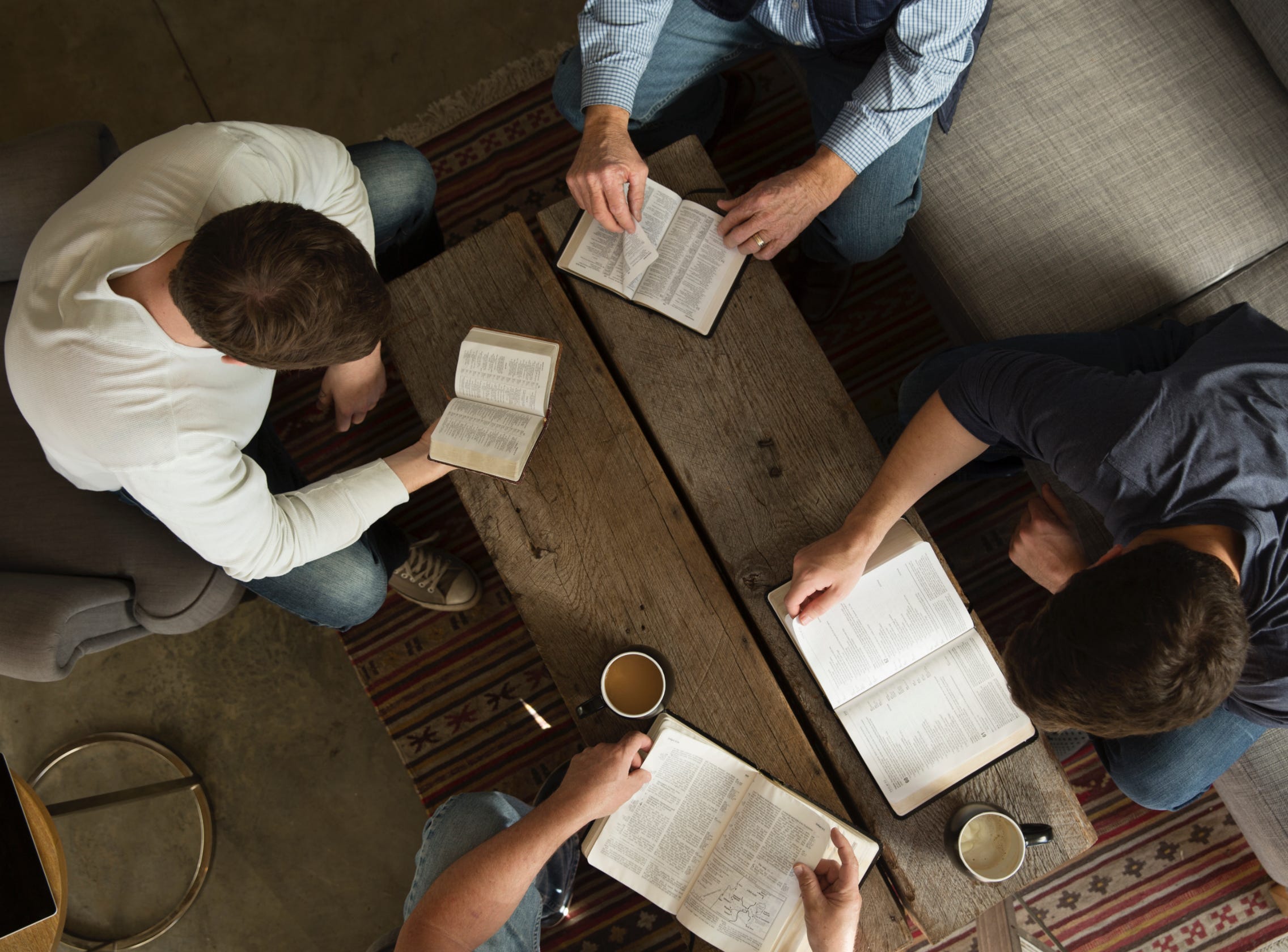 Top-down view of men studying together